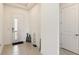 Bright entryway with tile flooring, featuring a modern front door and decorative vases at 2658 Meadowedge Loop, St Cloud, FL 34772