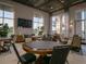 Well-lit game room with tables, chairs, and large windows offering scenic views at 2658 Meadowedge Loop, St Cloud, FL 34772