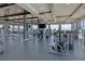 Well-equipped gym with modern exercise machines, large mirrors, and scenic views at 2658 Meadowedge Loop, St Cloud, FL 34772