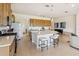 Open kitchen with a large island, breakfast bar seating, stainless steel appliances, and ample storage at 2658 Meadowedge Loop, St Cloud, FL 34772