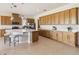 Bright kitchen with large island, stainless appliances, pendant lighting, and generous cabinet space at 2658 Meadowedge Loop, St Cloud, FL 34772