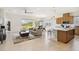 Open-concept living room, with lots of natural light, a modern kitchen, and dining area at 2658 Meadowedge Loop, St Cloud, FL 34772