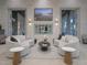 Comfortable lounge area with stylish furnishings, decorative stone wall, and a cozy atmosphere at 2658 Meadowedge Loop, St Cloud, FL 34772