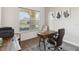 Bright office featuring a wooden desk, a large window, and a neutral color palette at 2658 Meadowedge Loop, St Cloud, FL 34772