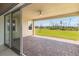 View of the large outdoor patio, with brick pavers, and a ceiling fan at 2658 Meadowedge Loop, St Cloud, FL 34772