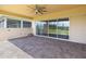 Covered patio has brick pavers and a ceiling fan, great for relaxing outside at 2658 Meadowedge Loop, St Cloud, FL 34772