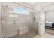 Modern walk-in shower with dual shower heads and a glass door, offering a luxurious experience at 2658 Meadowedge Loop, St Cloud, FL 34772