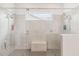 Modern walk-in shower with dual shower heads and a glass door, offering a luxurious experience at 2658 Meadowedge Loop, St Cloud, FL 34772