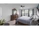 Spacious bedroom with a large dresser, ceiling fan, and ample natural light from the windows at 2724 Camden Ln, Davenport, FL 33837