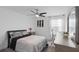 Modern bedroom with a sleek ceiling fan, comfortable bed, and a bright, airy ambiance at 2724 Camden Ln, Davenport, FL 33837
