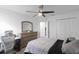 Contemporary bedroom with a desk, dresser, and comfortable bed, perfect for relaxation and productivity at 2724 Camden Ln, Davenport, FL 33837