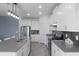 Bright kitchen boasts a spacious island, modern appliances, and sleek white cabinets for a stylish and functional design at 2724 Camden Ln, Davenport, FL 33837