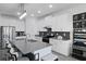 Modern kitchen with stainless steel appliances, a large island, and white cabinetry for a clean, contemporary look at 2724 Camden Ln, Davenport, FL 33837