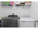 Convenient laundry room featuring side-by-side washer and dryer units at 2724 Camden Ln, Davenport, FL 33837