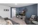 Cozy living room with gray sofa, recliner, modern entertainment center and unique wall art at 2724 Camden Ln, Davenport, FL 33837