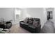 Cozy upstairs living room with comfortable seating, offering a relaxing retreat with natural light from the window at 2724 Camden Ln, Davenport, FL 33837