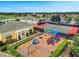 Community playground and tennis courts, showcasing recreational amenities for active lifestyles in a sunny, outdoor setting at 2724 Camden Ln, Davenport, FL 33837