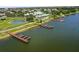 Aerial view of the neighborhood amenities, including a clubhouse and a lake at 2885 Attwater Loop, Winter Haven, FL 33884