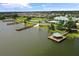 Aerial view of the neighborhood amenities, including a clubhouse, lake, and pond at 2885 Attwater Loop, Winter Haven, FL 33884