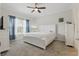 Serene bedroom featuring soft carpet, natural light, and a ceiling fan at 2885 Attwater Loop, Winter Haven, FL 33884