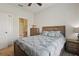 Bedroom showcasing an ensuite bathroom with coordinating furniture and neutral carpet at 2885 Attwater Loop, Winter Haven, FL 33884