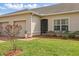 Landscaped home exterior features a well-maintained lawn and a two car garage at 2885 Attwater Loop, Winter Haven, FL 33884