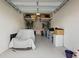 Functional garage provides ample storage space with overhead racks at 2885 Attwater Loop, Winter Haven, FL 33884