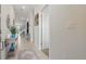 Bright hallway with tiled floors leads to an open living space at 2885 Attwater Loop, Winter Haven, FL 33884