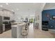 Open kitchen boasts modern appliances and a breakfast bar at 2885 Attwater Loop, Winter Haven, FL 33884