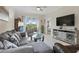 Open living area showcases stylish decor and access to outdoor balcony with scenic views at 2885 Attwater Loop, Winter Haven, FL 33884