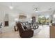 Bright living room boasts a comfortable seating arrangement and scenic balcony access at 2885 Attwater Loop, Winter Haven, FL 33884