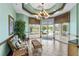 Lobby area with decorative chandelier, tiled floors, large windows and comfortable seating at 2885 Attwater Loop, Winter Haven, FL 33884