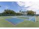 Well-maintained community tennis courts featuring multiple courts, new nets, and pristine playing surfaces at 2885 Attwater Loop, Winter Haven, FL 33884