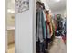 Spacious walk-in closet offering ample storage space with shelving and hanging racks at 2885 Attwater Loop, Winter Haven, FL 33884