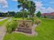 Entrance sign for Villa Sol with palm trees and landscaping at 2926 Siesta View Dr, Kissimmee, FL 34744