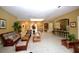 Inviting clubhouse lobby with comfortable seating, skylight, and coffee bar at 2926 Siesta View Dr, Kissimmee, FL 34744