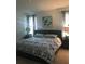 Well-lit bedroom with neutral decor featuring a large bed and windows with curtains at 2926 Siesta View Dr, Kissimmee, FL 34744