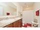 Bathroom featuring a double vanity with framed mirrors and a shower/tub combo at 297 Gina Ln, Davenport, FL 33837
