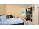 Functional bedroom featuring a window view and a TV, offering comfort and convenience at 297 Gina Ln, Davenport, FL 33837
