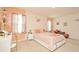 Comfortable bedroom featuring decoratively painted walls, a cozy bed, and lots of natural light at 297 Gina Ln, Davenport, FL 33837