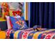 Themed ' bedroom with bed featuring custom Paw Patrol pillows and decor at 3055 Yellow Lantana Ln, Kissimmee, FL 34747