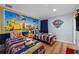 Fun themed ' bedroom with two twin beds, colorful decor, and Paw Patrol mural at 3055 Yellow Lantana Ln, Kissimmee, FL 34747
