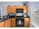 Updated kitchen with granite counters, stainless appliances, and natural light at 3055 Yellow Lantana Ln, Kissimmee, FL 34747