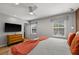 Cozy bedroom with plenty of light and a large bed at 3055 Yellow Lantana Ln, Kissimmee, FL 34747