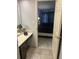 Bathroom view to bedroom, highlighting tile flooring and an open doorway at 3100 Parkway Blvd # 325, Kissimmee, FL 34747