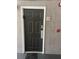 Condo entrance featuring a six-panel front door with a digital lock at 3100 Parkway Blvd # 325, Kissimmee, FL 34747