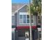 Building exterior with palm trees and covered parking at 3100 Parkway Blvd # 325, Kissimmee, FL 34747
