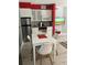 Contemporary kitchen and dining area with stainless appliances and white cabinets at 3100 Parkway Blvd # 325, Kissimmee, FL 34747