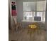 Bright living space with natural light, a desk and two chairs next to the window at 3100 Parkway Blvd # 325, Kissimmee, FL 34747