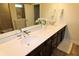 Elegant bathroom with double sinks and a framed mirror at 3262 Hanging Tide St, Winter Garden, FL 34787